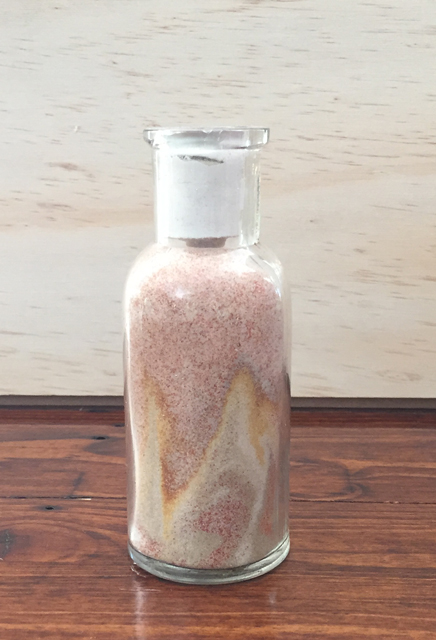 About 4.5 inches tall, and losing its pattern. A Minnehaha sand bottle.