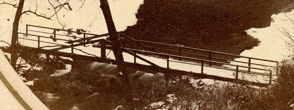 a close up of the first bridge, with intact railings.
