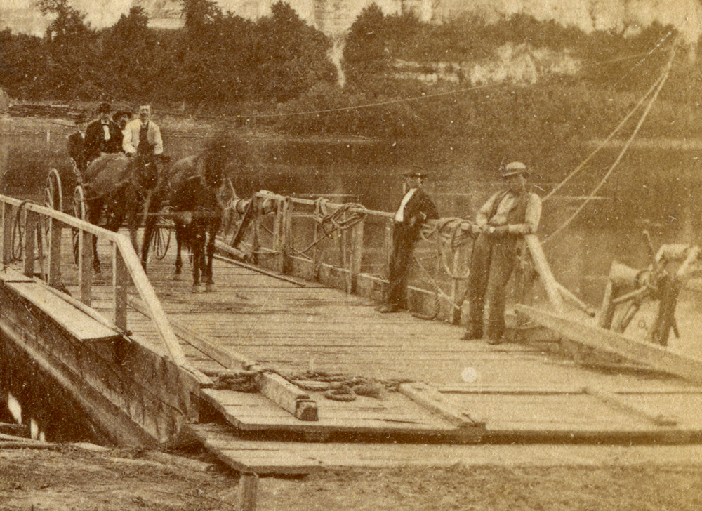 A closer look at the ferry, ashore on the Mississippi's east bank. Three men are in a buggy drawn by 2 horses